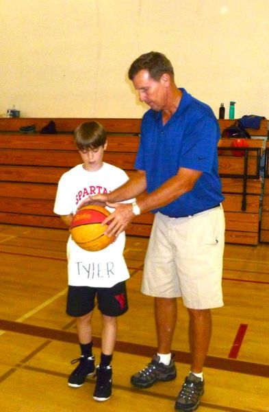 Camper dribbling past a defender